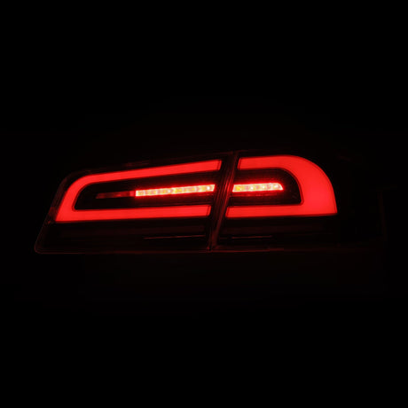12-21 Tesla Model S LUXX-Series LED Tail Lights Alpha-Black (With Black Trunk Center Piece Replacement)